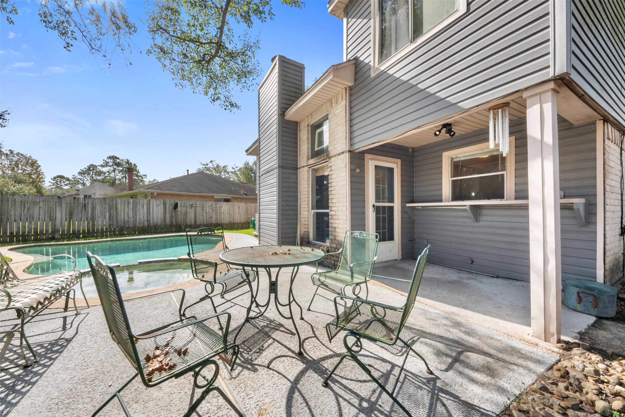 17314 Edenbridge Court Spring, TX 77379 - Photo 27 of 33 a view of a patio with table and chairs and potted plants