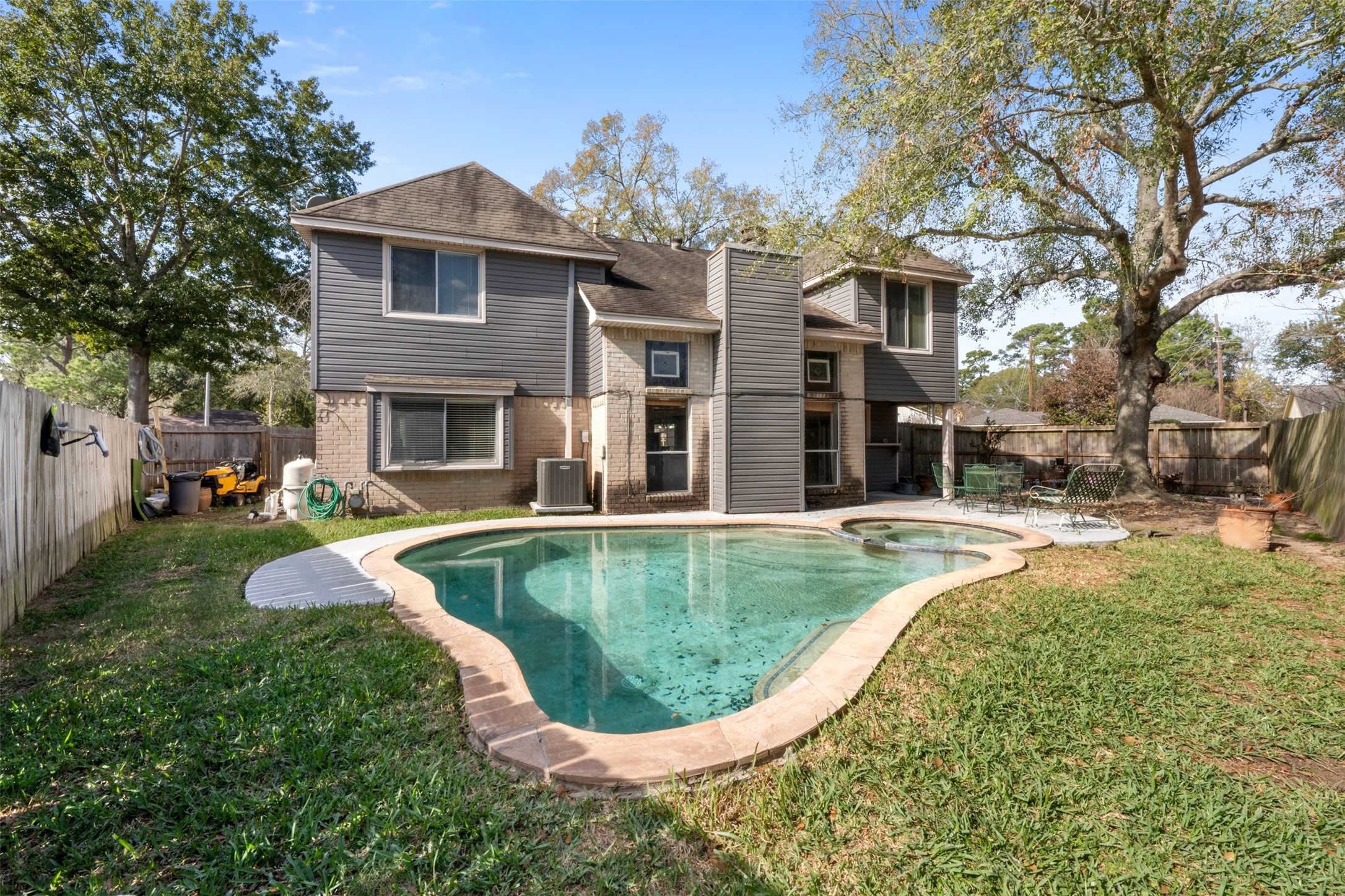 17314 Edenbridge Court Spring, TX 77379 - Photo 28 of 33 a view of a house with swimming pool