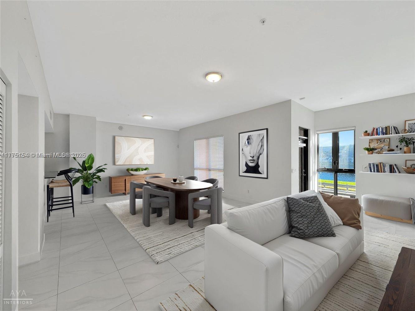 8390 Southwest 72nd Avenue, Unit 106 Miami, FL 33143 - Photo 1 of 7 a living room with furniture a rug and a window