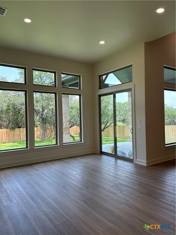5903 Whippoorwill Road Temple, TX 76502 - Photo 12 of 27 a view of an empty room with wooden floor and a window