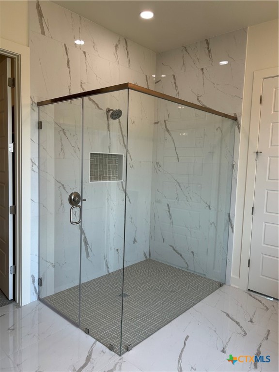 5903 Whippoorwill Road Temple, TX 76502 - Photo 15 of 27 a bathroom with a glass shower door