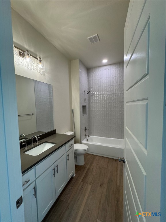 5903 Whippoorwill Road Temple, TX 76502 - Photo 19 of 27 a bathroom with a granite countertop sink a toilet and shower