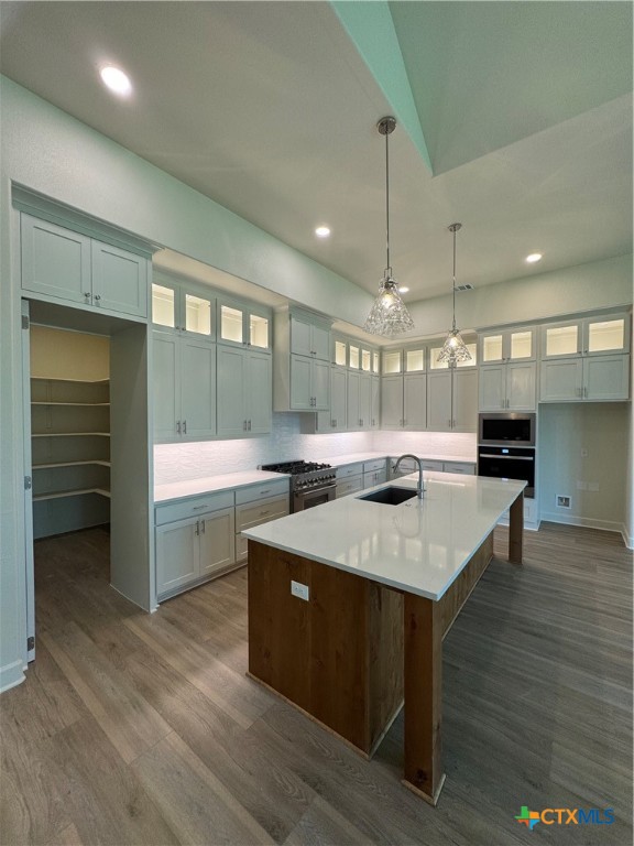 5903 Whippoorwill Road Temple, TX 76502 - Photo 9 of 27 a kitchen with a stove a counter space a sink and cabinets