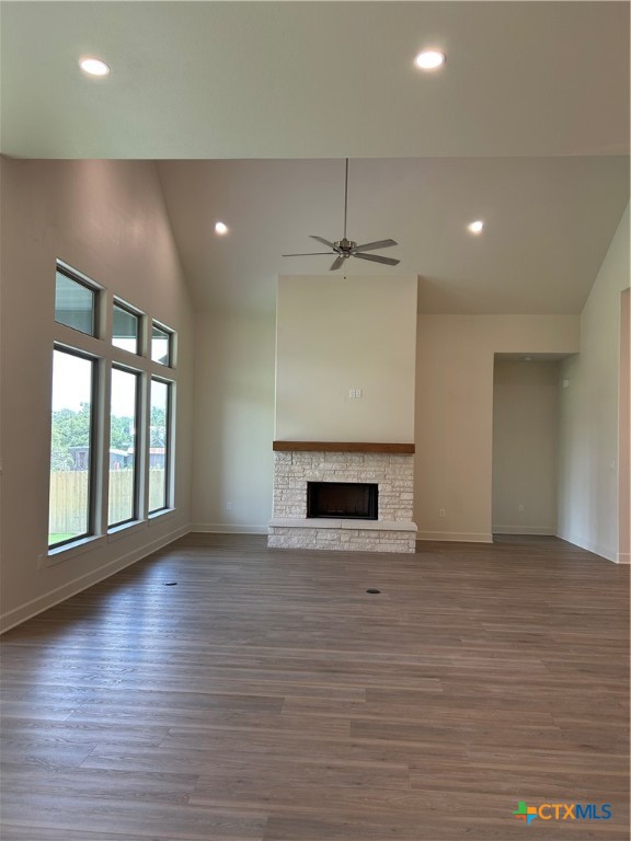 5903 Whippoorwill Road Temple, TX 76502 - Photo 10 of 27 an empty room with wooden floor fireplace and windows