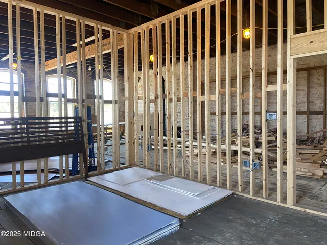 a view of a balcony with outdoor seating