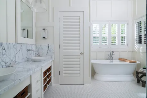 a view of a patio with table and chairs and potted plants