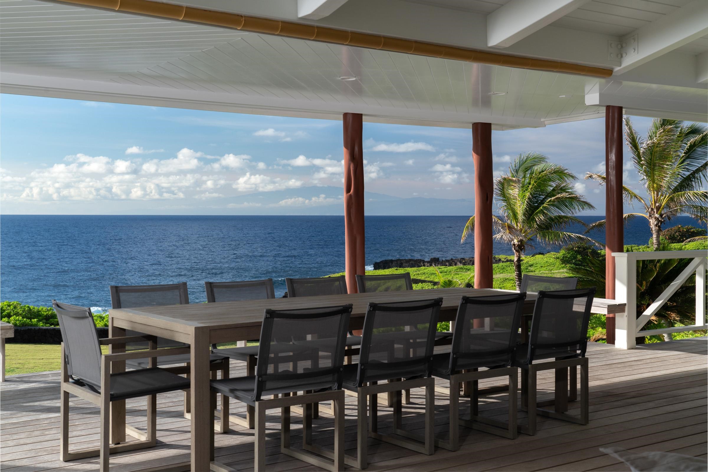 51 Kapohue Road Hana, HI 96713 - Photo 16 of 50 a view of a patio with table and chairs and potted plants