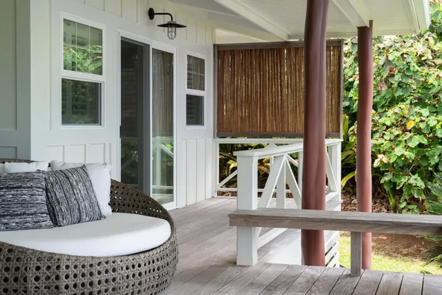 a view of a pathway with potted plants