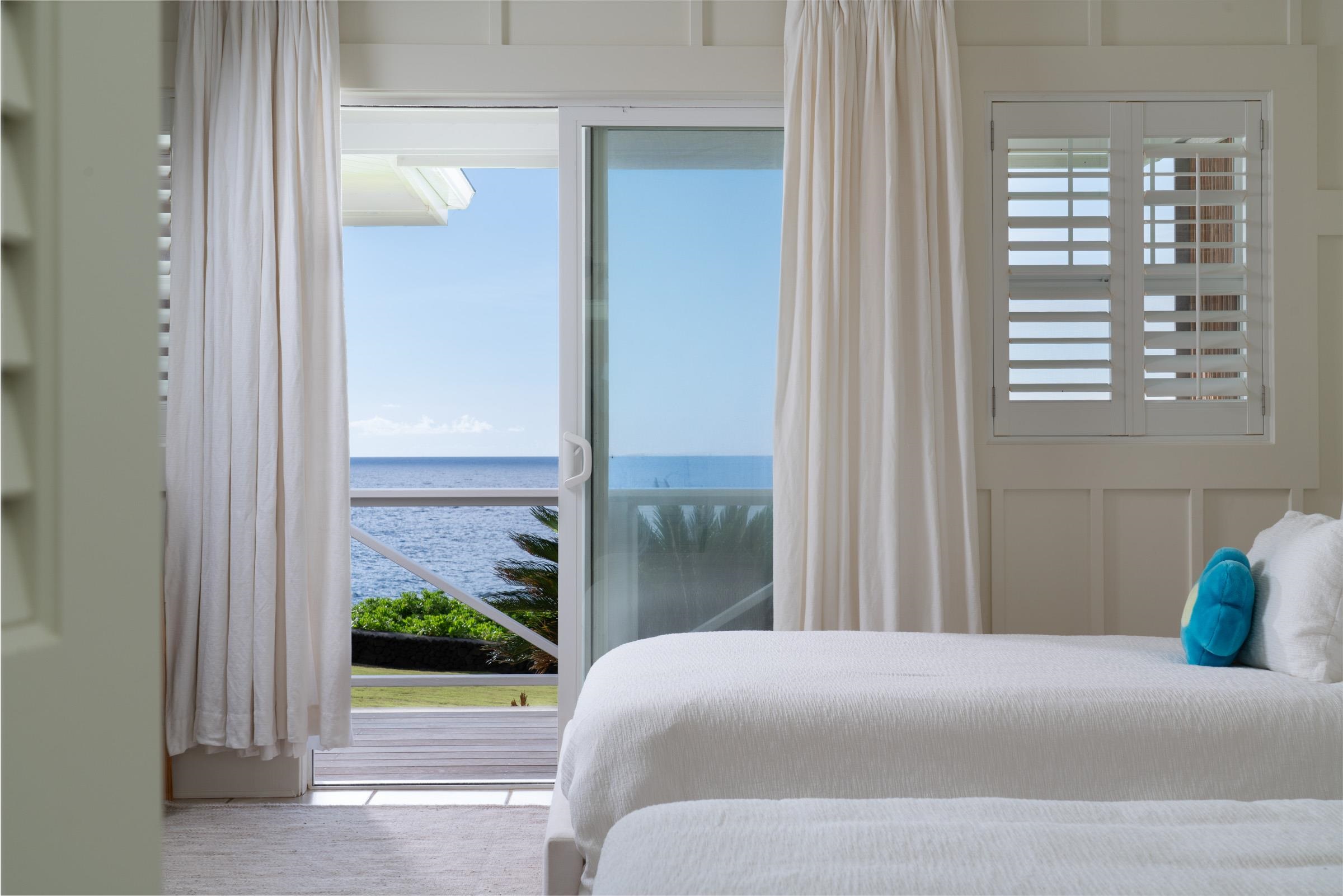 51 Kapohue Road Hana, HI 96713 - Photo 25 of 50 a bedroom with a bed and a window