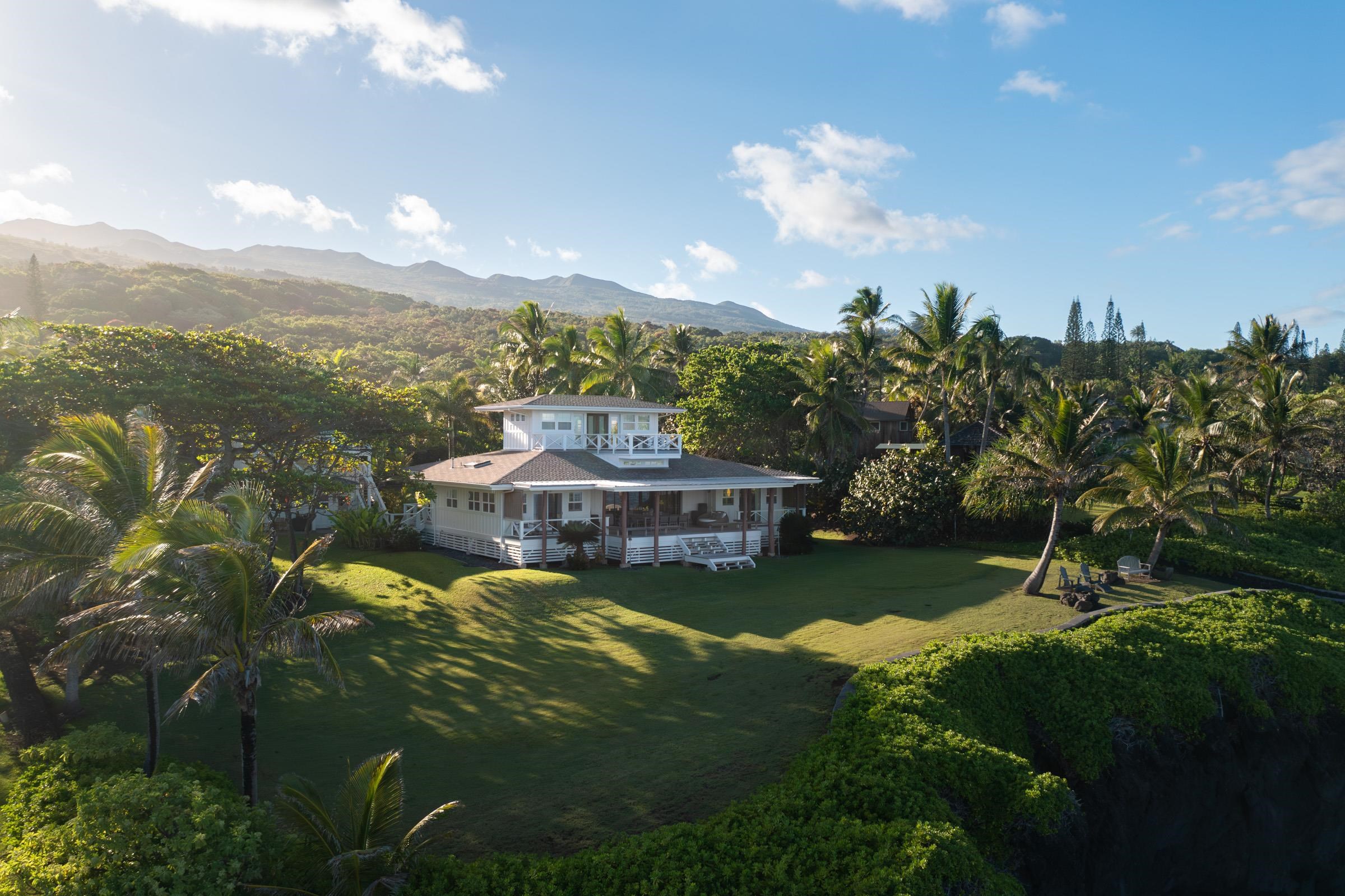 51 Kapohue Road Hana, HI 96713 - Photo 3 of 50 a view of a lake with a mountain in the background