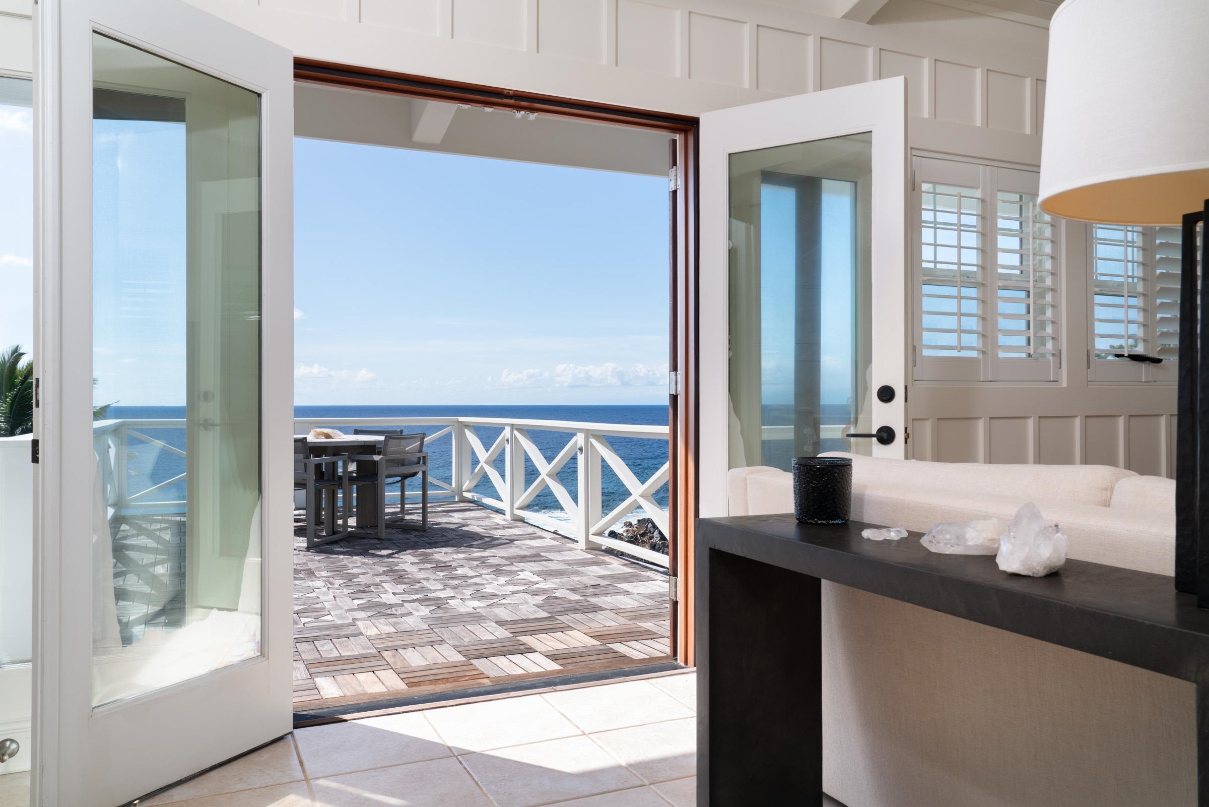 51 Kapohue Road Hana, HI 96713 - Photo 36 of 50 a bathroom with granite countertop a sink and a mirror