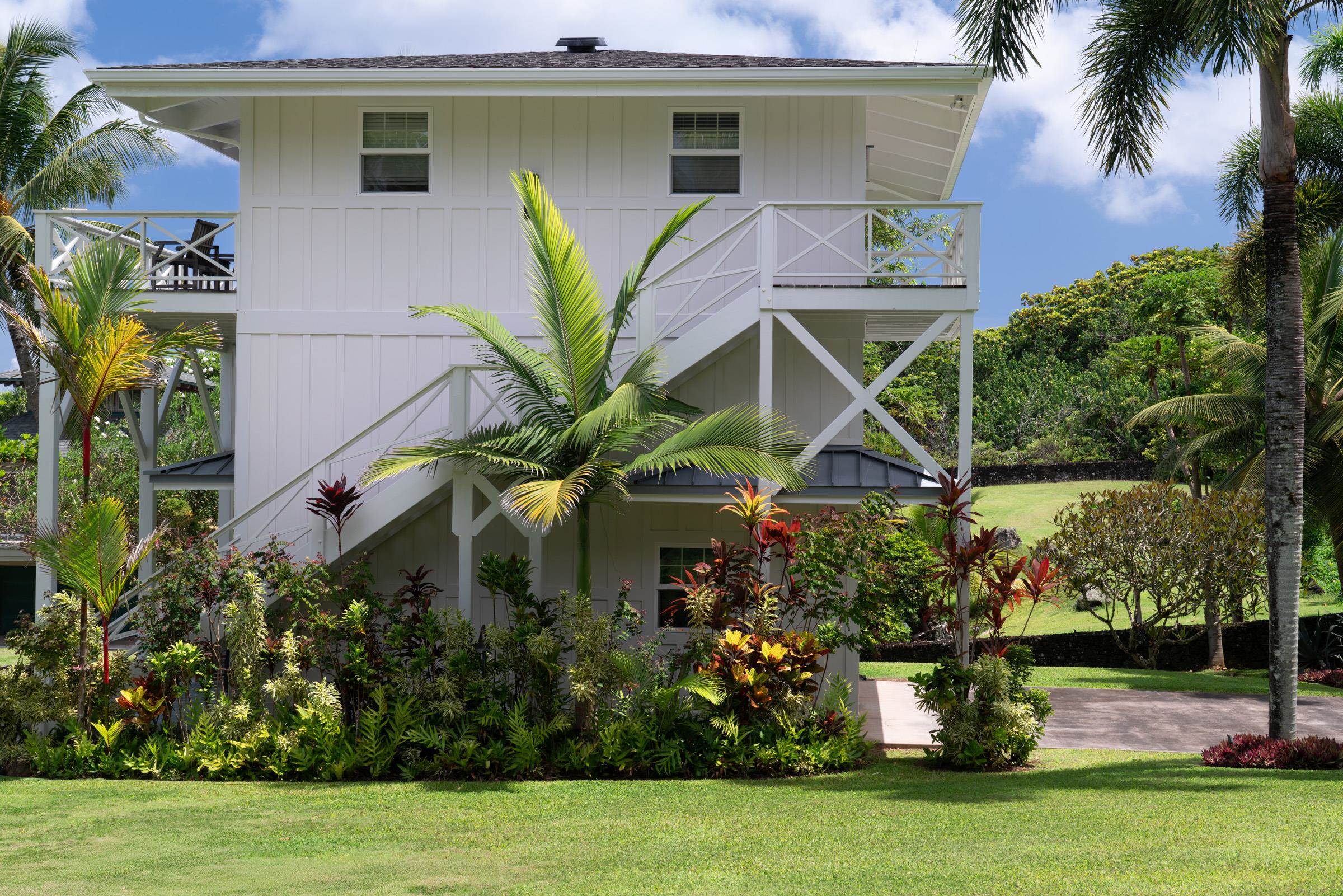 51 Kapohue Road Hana, HI 96713 - Photo 42 of 50 a front view of a house with garden