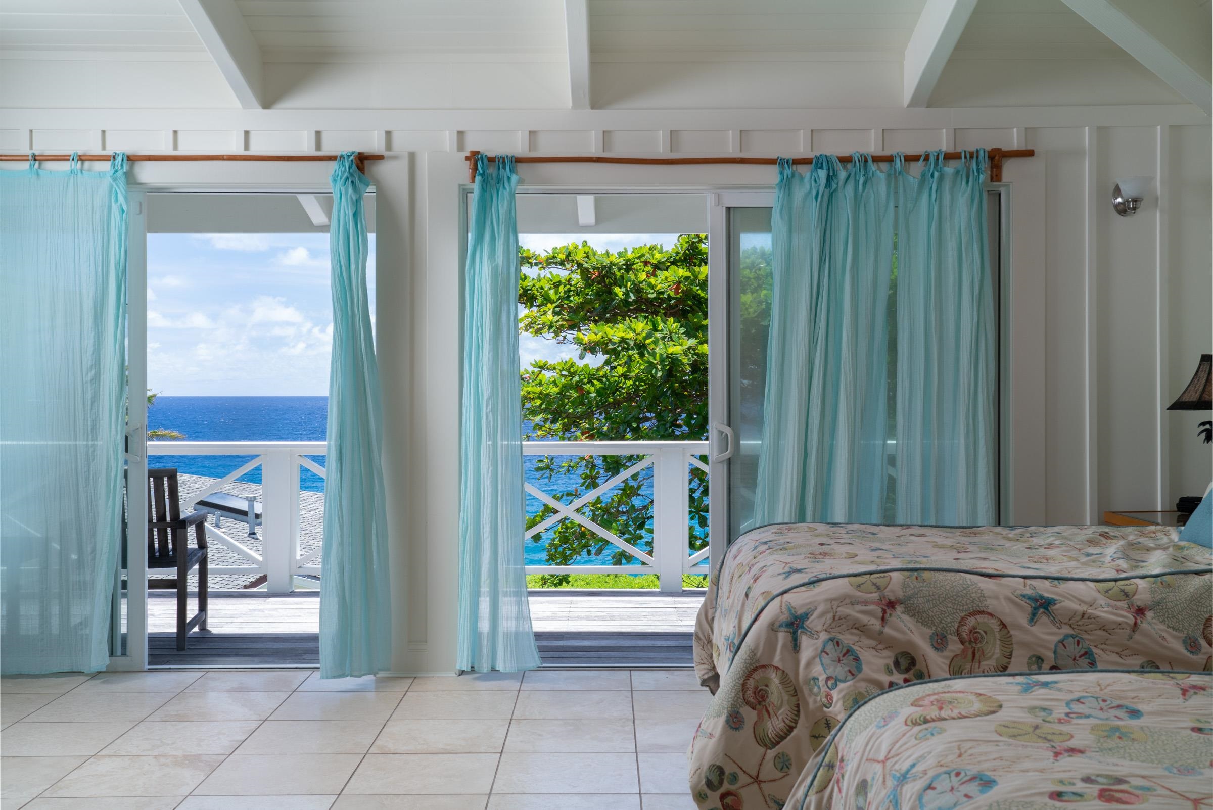 51 Kapohue Road Hana, HI 96713 - Photo 44 of 50 a bed sitting in a bedroom next to a window