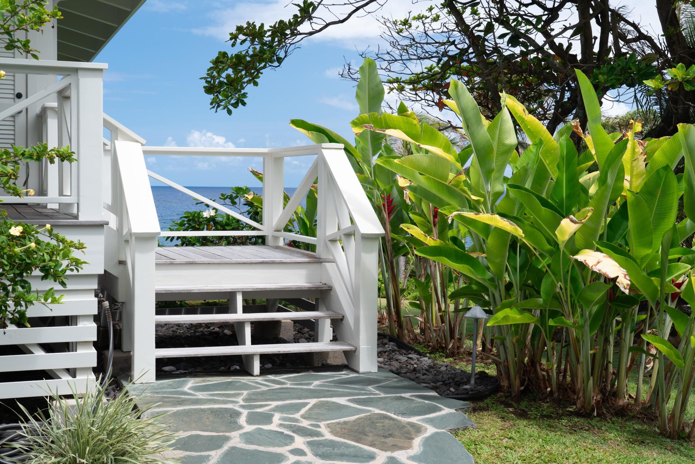51 Kapohue Road Hana, HI 96713 - Photo 5 of 50 a house with a tree in front of it