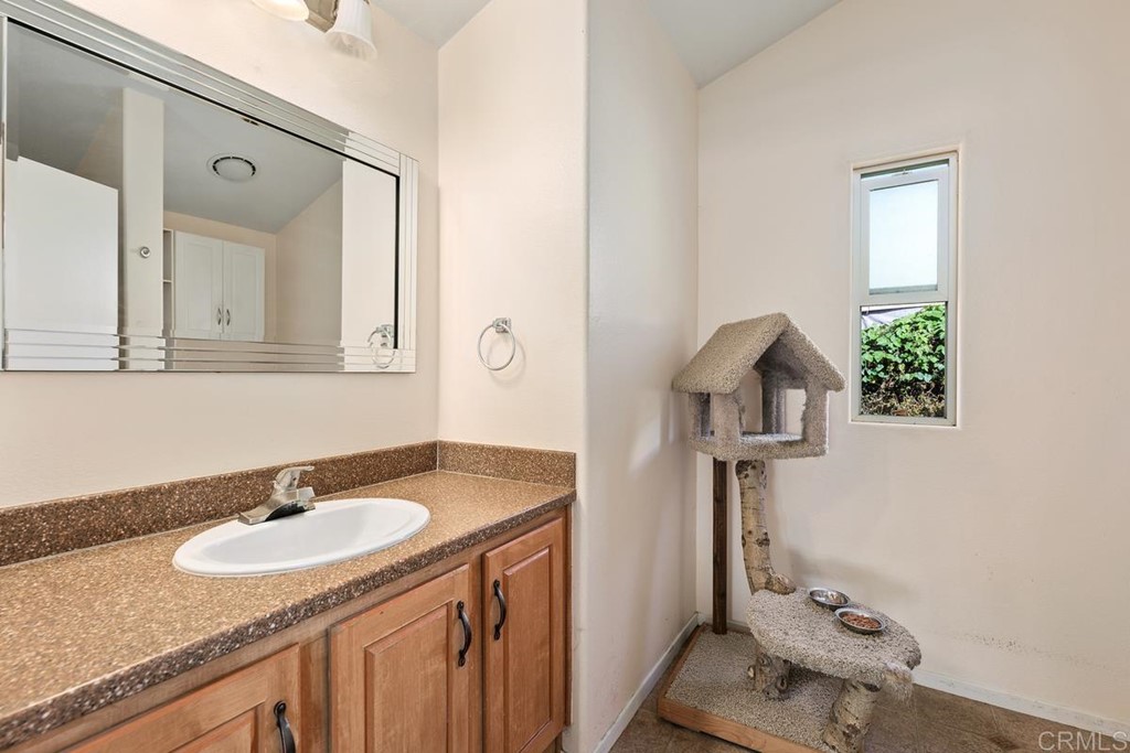 3909 Reche Road, Unit 195 Fallbrook, CA 92028 - Photo 11 of 25 a bathroom with a sink and a mirror