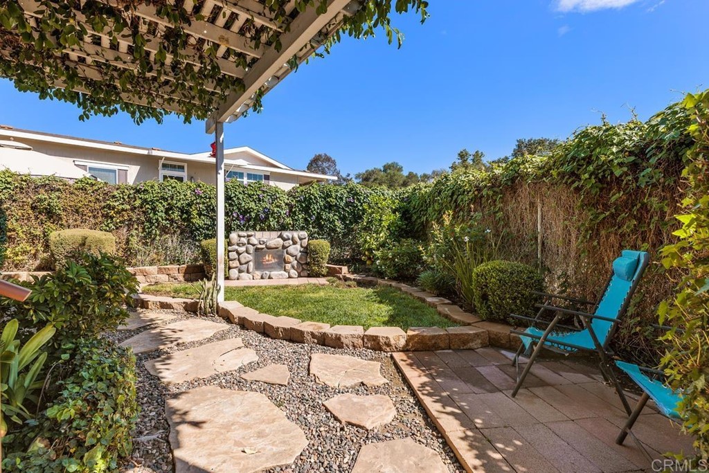 3909 Reche Road, Unit 195 Fallbrook, CA 92028 - Photo 12 of 25 a backyard of a house with outdoor seating and green space