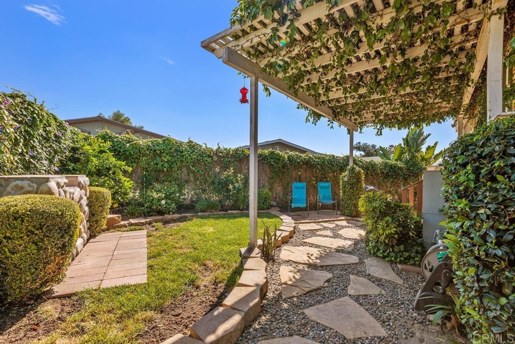 3909 Reche Road, Unit 195 Fallbrook, CA 92028 - Photo 13 of 25 a front view of a house with garden