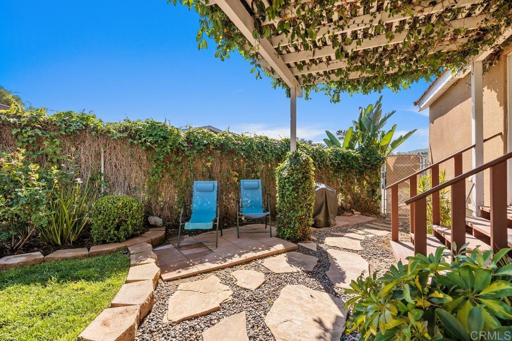 3909 Reche Road, Unit 195 Fallbrook, CA 92028 - Photo 15 of 25 a view of a backyard with plants and a patio