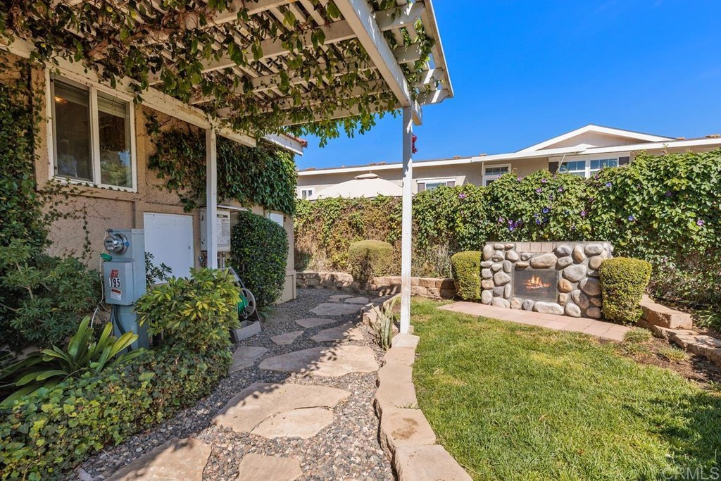 3909 Reche Road, Unit 195 Fallbrook, CA 92028 - Photo 16 of 25 a house view with a garden space