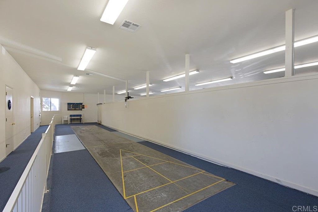 3909 Reche Road, Unit 195 Fallbrook, CA 92028 - Photo 19 of 25 a lobby with a couch and a chandelier