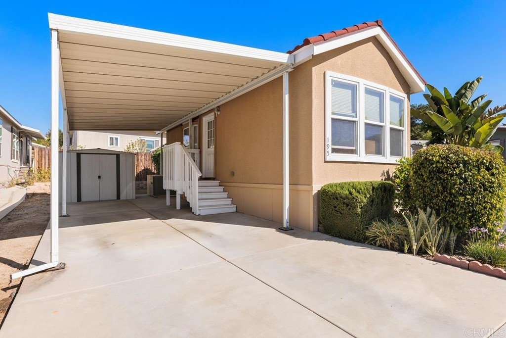 3909 Reche Road, Unit 195 Fallbrook, CA 92028 - Photo 3 of 25 a view of a house with a backyard