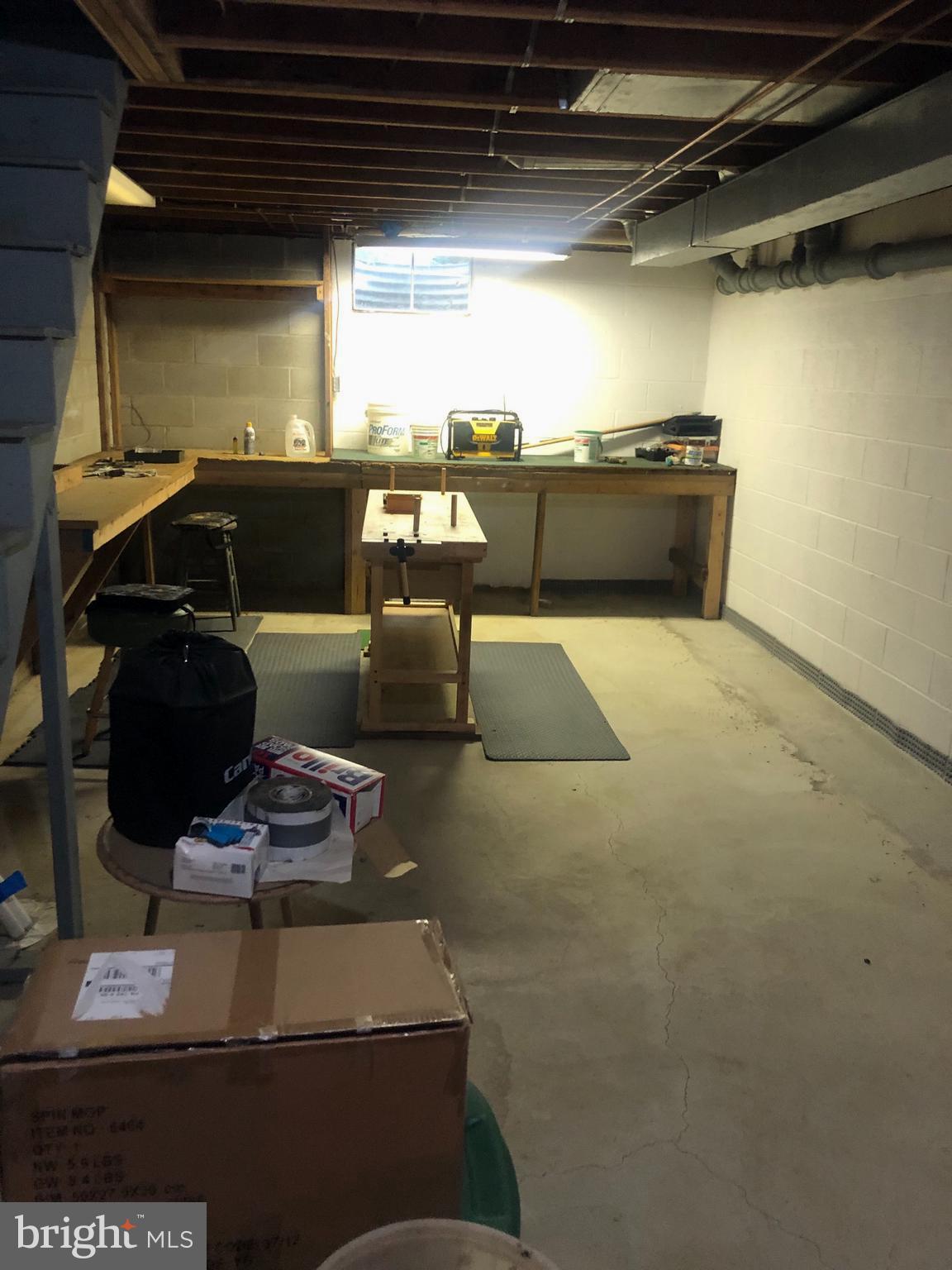 727 Pheasant Run Road West Chester, PA 19382 - Photo 51 of 73 Basement with wood working table