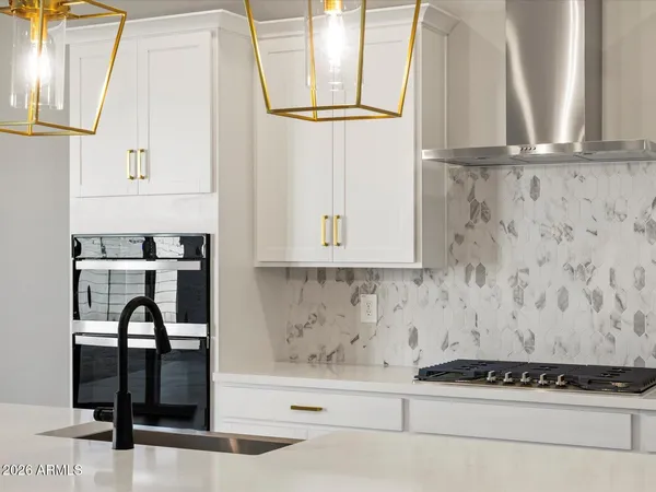 a view of kitchen with wooden floor and cabinets