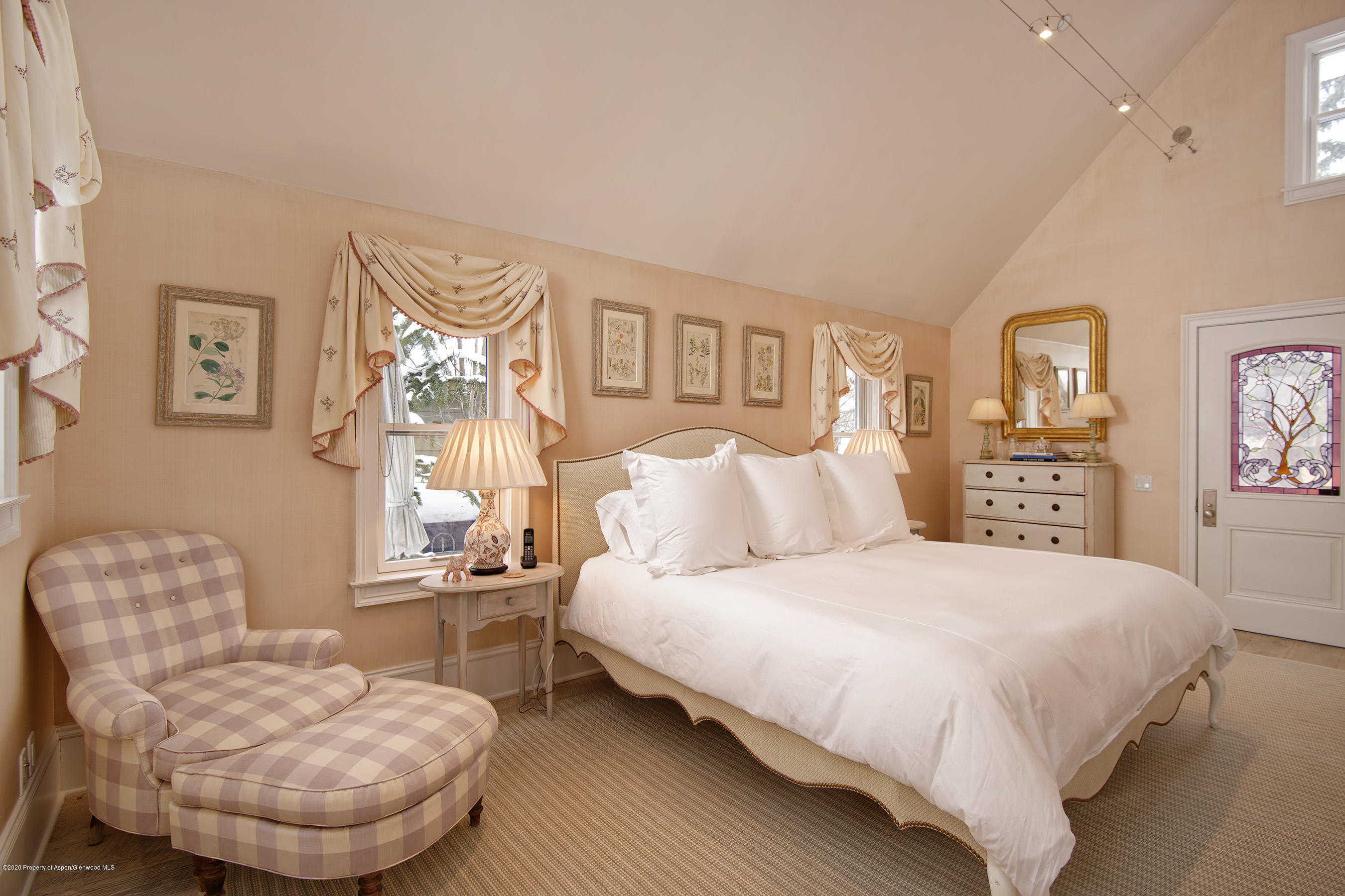 716 West Francis Street Aspen, CO 81611 - Photo 11 of 26 a bedroom with a bed and a chair