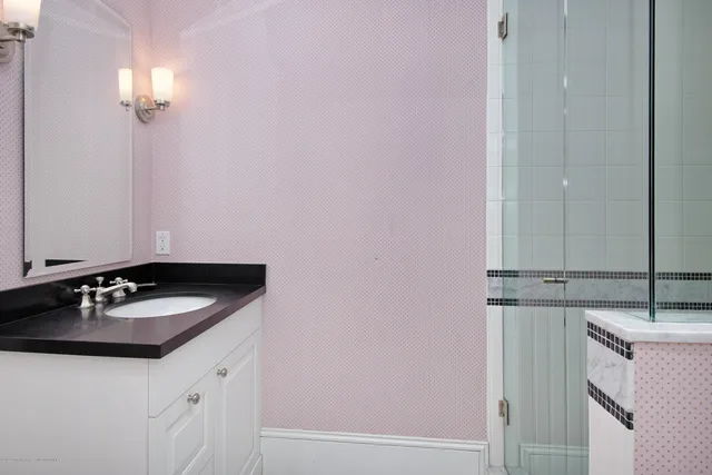 a bathroom with a sink and a mirror