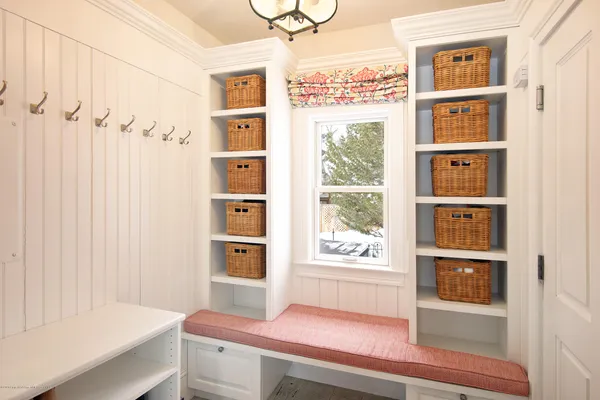 a room that has a bed and a window in it