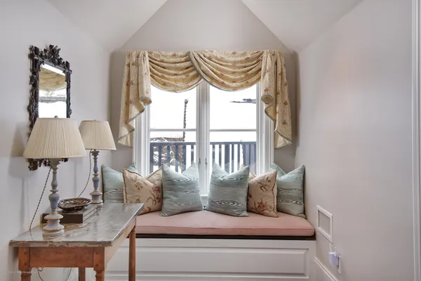 a bedroom with furniture and a window