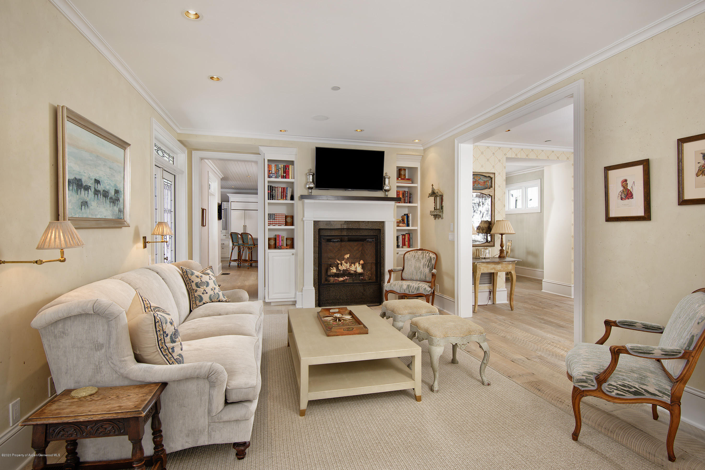 716 West Francis Street Aspen, CO 81611 - Photo 3 of 26 a living room with furniture a flat screen tv and a fireplace