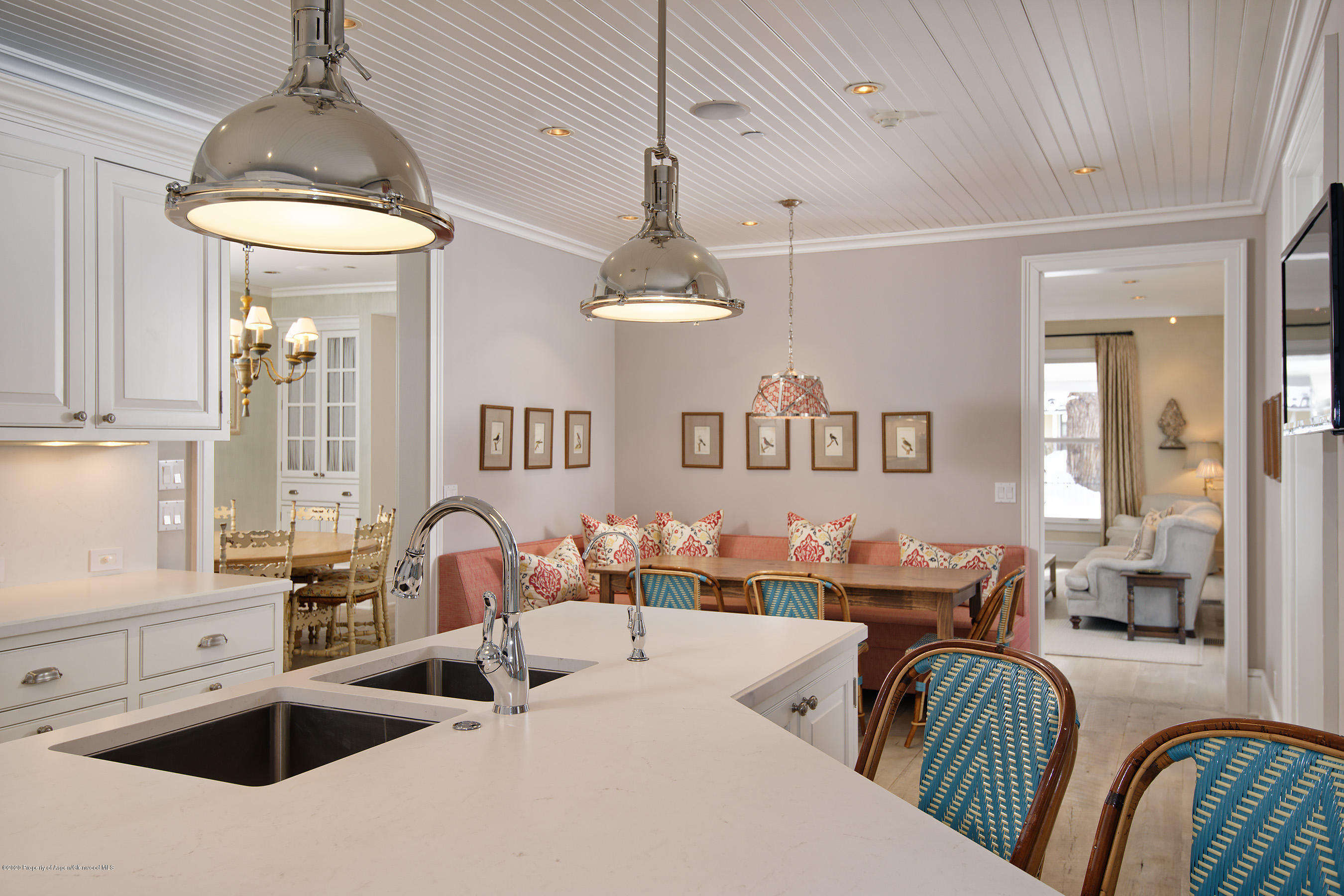 716 West Francis Street Aspen, CO 81611 - Photo 6 of 26 a kitchen with stainless steel appliances a table and chairs