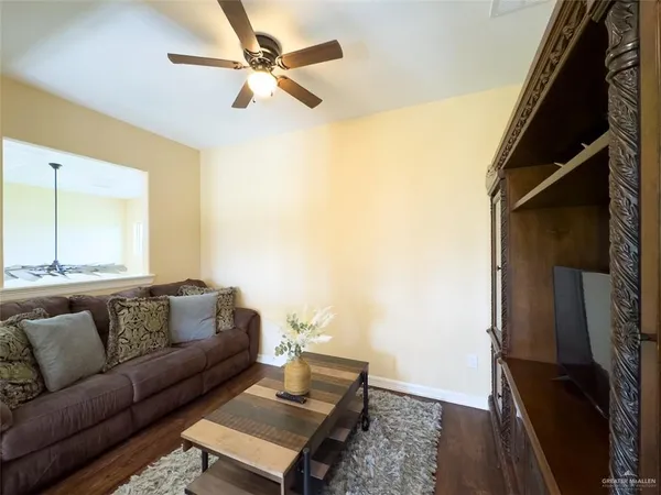 a living room with furniture and a rug