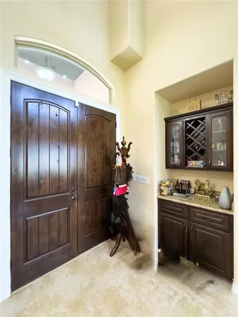 a kitchen with sink cabinets and stainless steel appliances