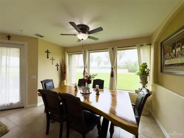 a view of a dining room with furniture window and outside view