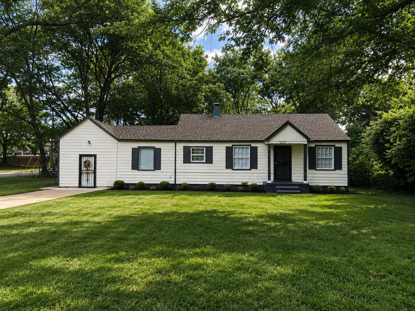 1311 Marlin Road Memphis, TN 38116 - Photo 1 of 6 Traditional single-story residence with a gable roof and light-colored siding
