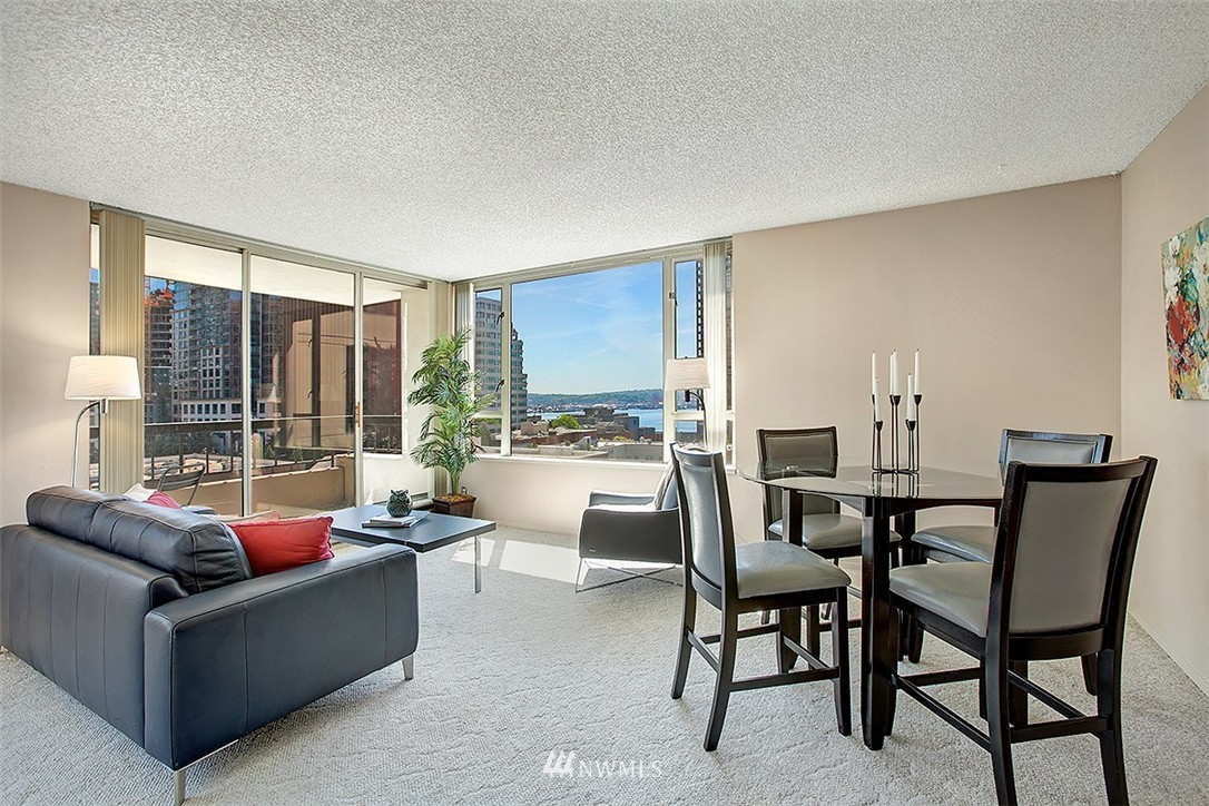 2201 3rd Avenue, Unit 1001 Seattle, WA 98121 - Photo 2 of 20 a living room with furniture and a large window