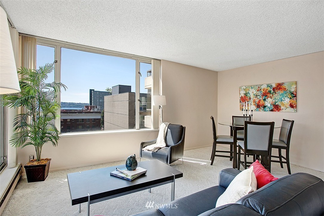 2201 3rd Avenue, Unit 1001 Seattle, WA 98121 - Photo 3 of 20 a living room with furniture and potted plant