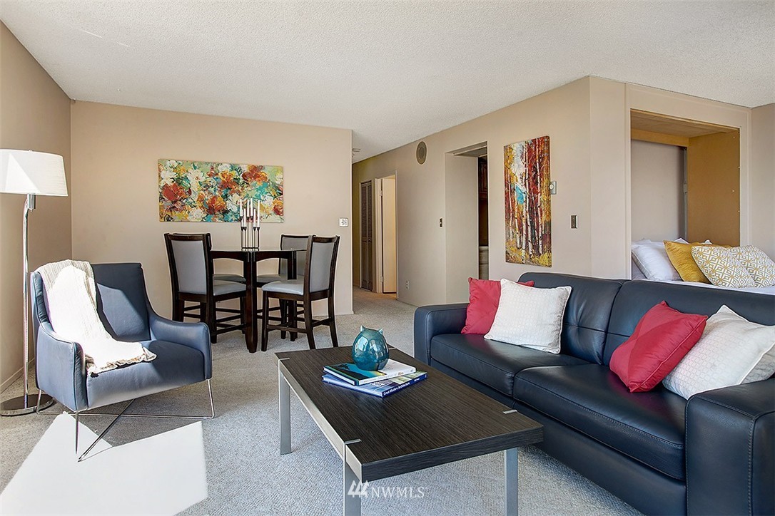 2201 3rd Avenue, Unit 1001 Seattle, WA 98121 - Photo 5 of 20 a living room with furniture and wooden floor