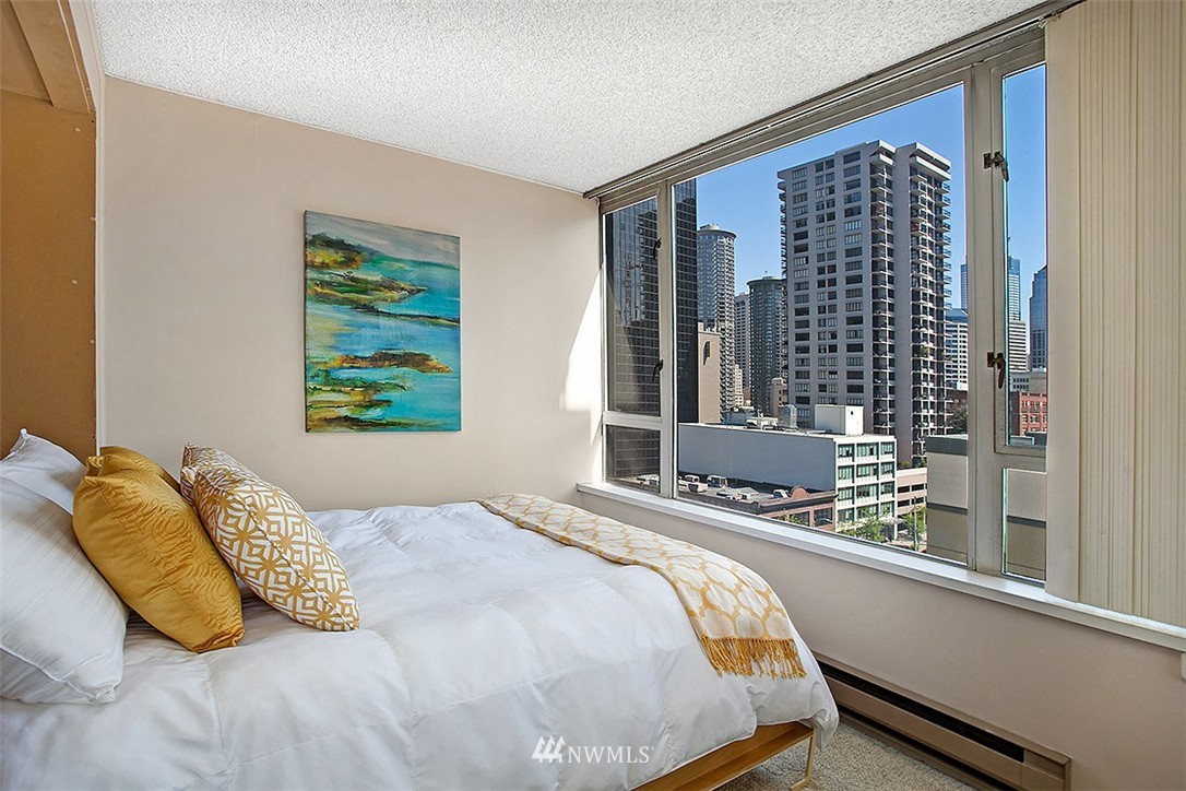 2201 3rd Avenue, Unit 1001 Seattle, WA 98121 - Photo 6 of 20 a bedroom with a bed and a window