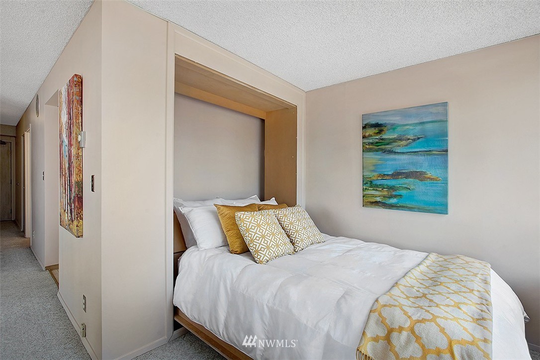 2201 3rd Avenue, Unit 1001 Seattle, WA 98121 - Photo 7 of 20 a bedroom with a bed and a window