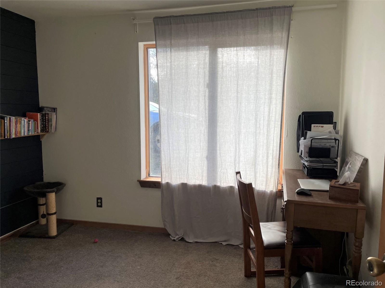 69 County Road 114 Bailey, CO 80421 - Photo 15 of 34 a view of a workspace with furniture and a window