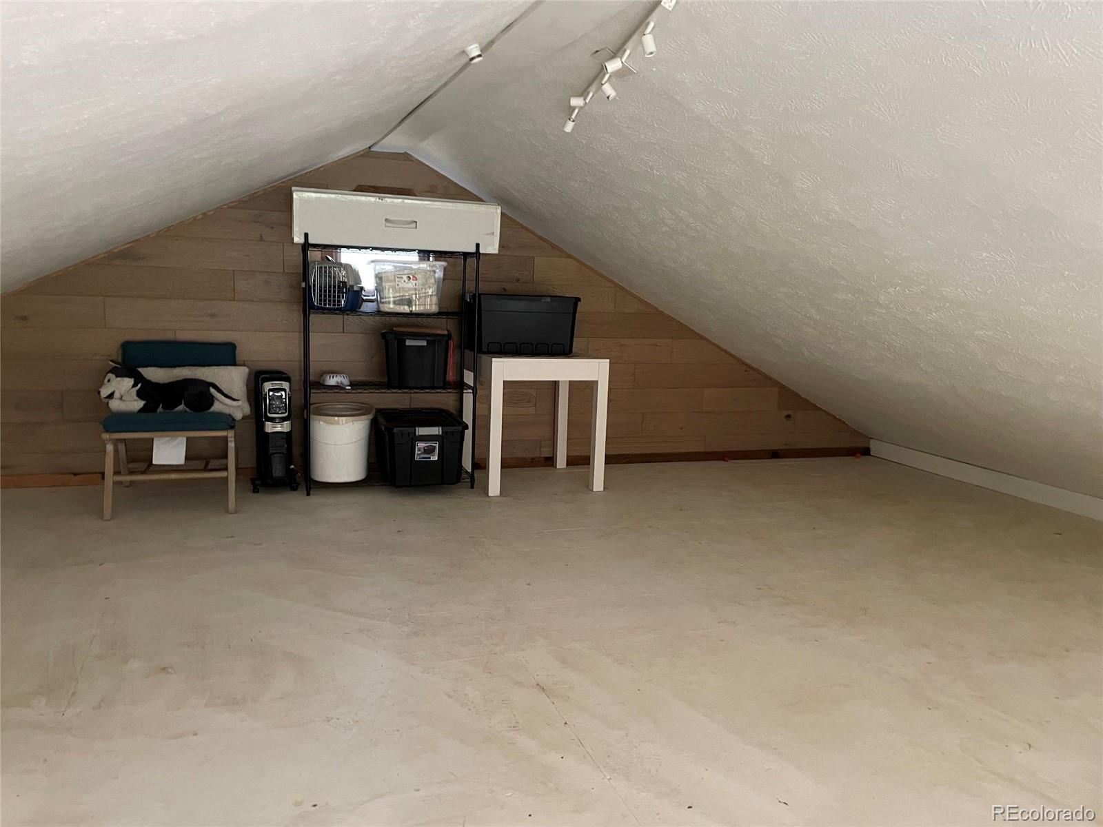 69 County Road 114 Bailey, CO 80421 - Photo 18 of 34 a view of a livingroom with furniture and a flat screen tv