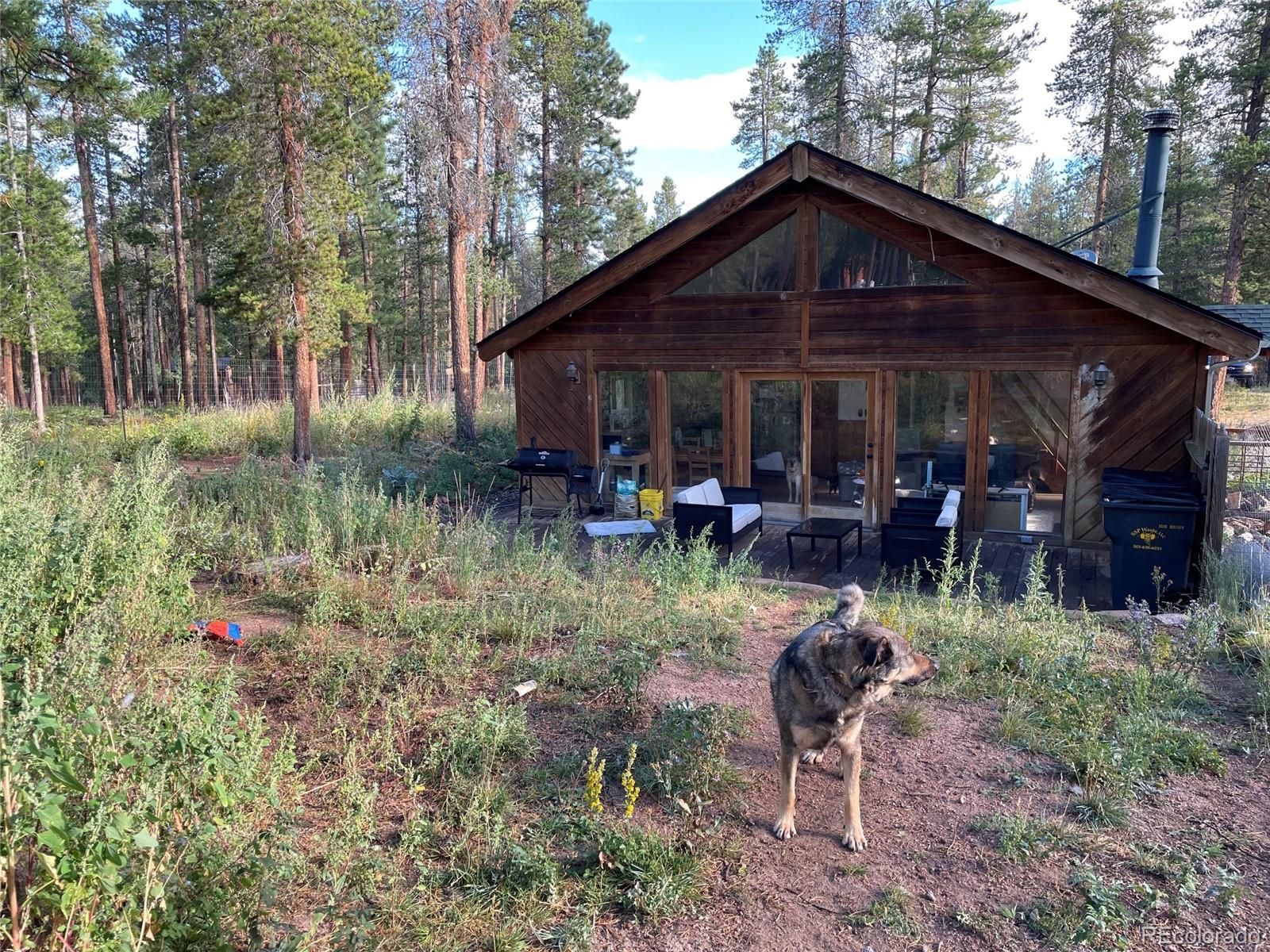 69 County Road 114 Bailey, CO 80421 - Photo 21 of 34 a view of a chair and table in the backyard