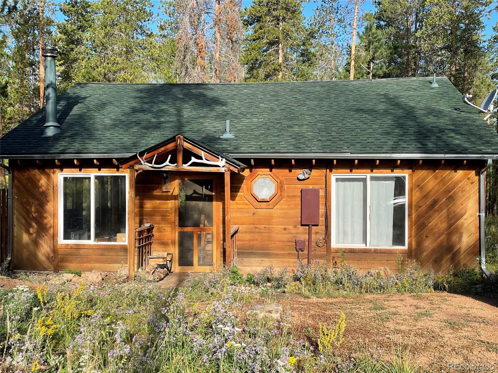 69 County Road 114 Bailey, CO 80421 - Photo 24 of 34 front view of a house with a yard