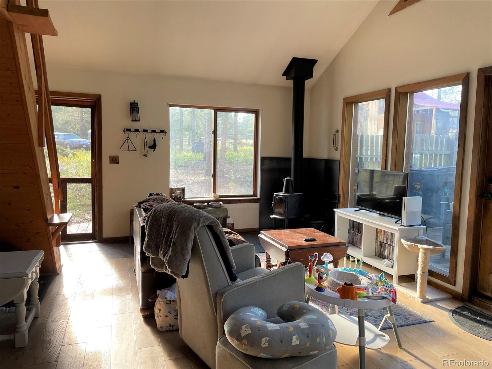 69 County Road 114 Bailey, CO 80421 - Photo 5 of 34 a bed room with furniture and a window