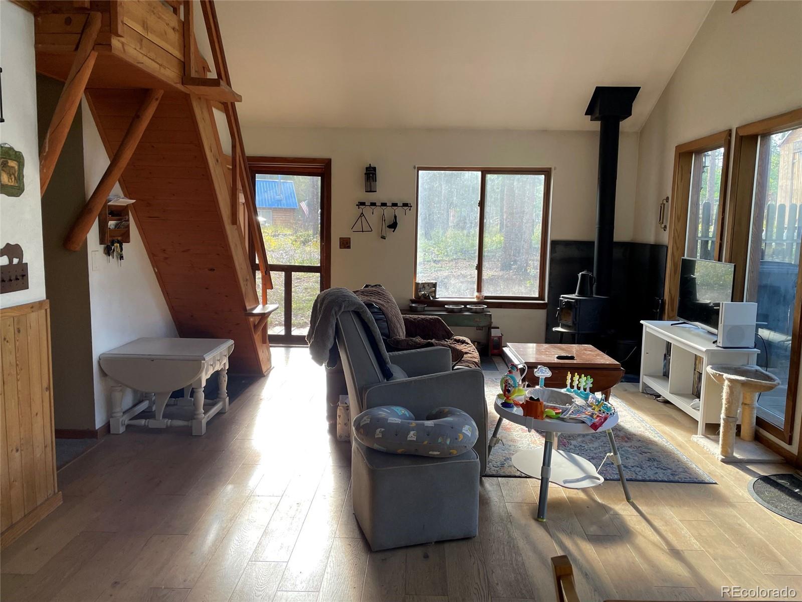 69 County Road 114 Bailey, CO 80421 - Photo 6 of 34 a living room with furniture and a window