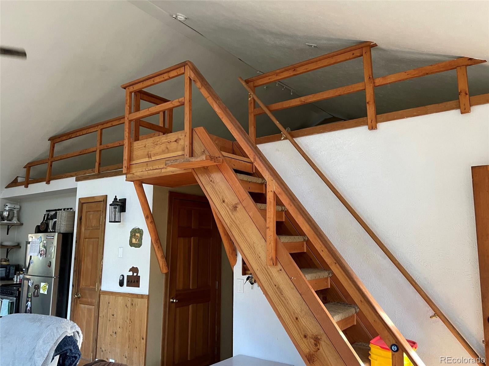 69 County Road 114 Bailey, CO 80421 - Photo 9 of 34 a view of walk in closet with clothes and shoes