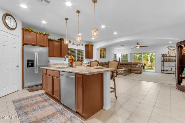 a view of a livingroom with furniture and a flat screen tv